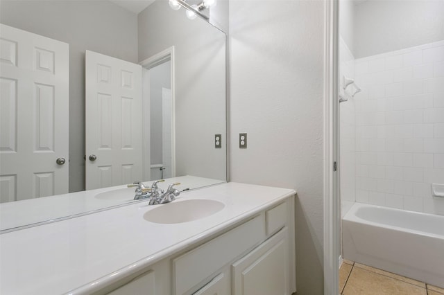 bathroom featuring tub / shower combination, vanity, and tile patterned floors