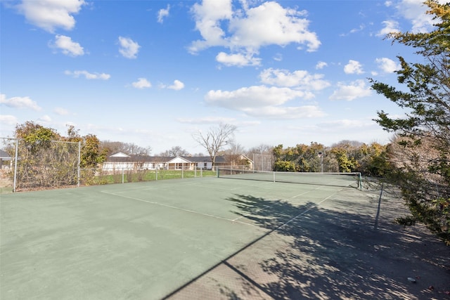 view of sport court with fence