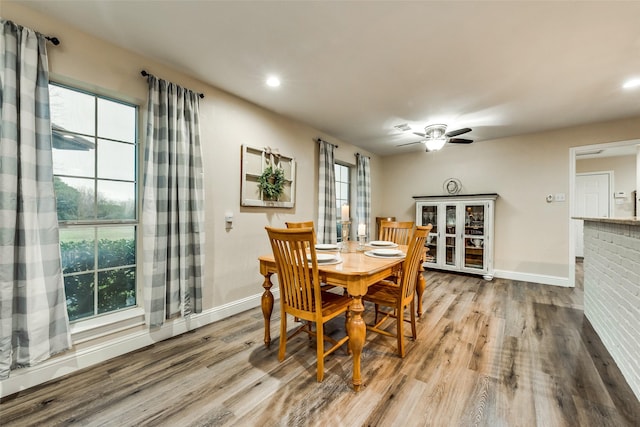 dining space featuring recessed lighting, baseboards, ceiling fan, and wood finished floors