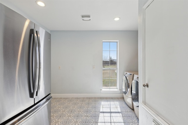 washroom featuring laundry area, light tile patterned floors, baseboards, recessed lighting, and washer and clothes dryer