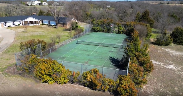 view of sport court featuring fence