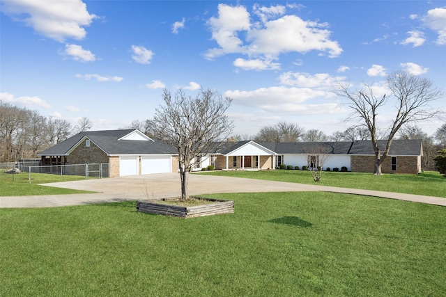 ranch-style house with concrete driveway, fence, a front yard, and a garage