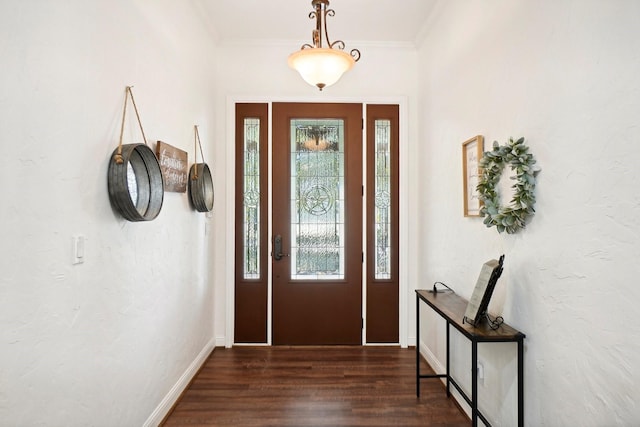 entryway with baseboards, ornamental molding, and dark wood finished floors