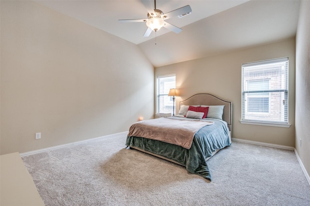 bedroom featuring carpet flooring, baseboards, lofted ceiling, and a ceiling fan