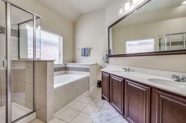 bathroom featuring a stall shower, a sink, tile patterned flooring, double vanity, and a bath