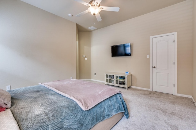 bedroom with a ceiling fan, baseboards, and carpet floors