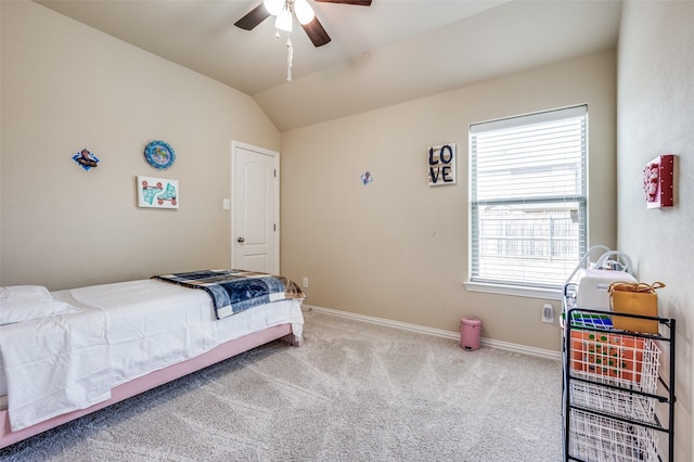 carpeted bedroom featuring ceiling fan, baseboards, and vaulted ceiling