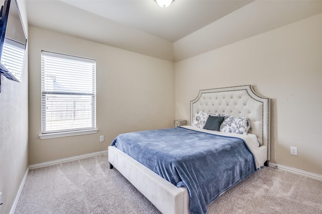 bedroom with baseboards and carpet floors