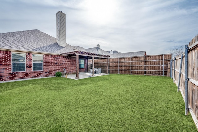 view of yard featuring a fenced backyard, a pergola, and a patio