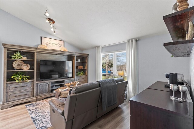 kitchen with decorative backsplash, light wood-type flooring, appliances with stainless steel finishes, and butcher block countertops