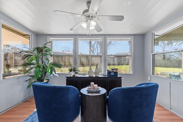 sunroom featuring ceiling fan