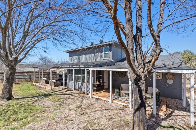 back of house featuring a patio area, a pergola, a shingled roof, and fence