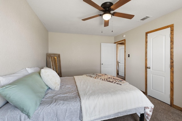 carpeted bedroom with visible vents and ceiling fan