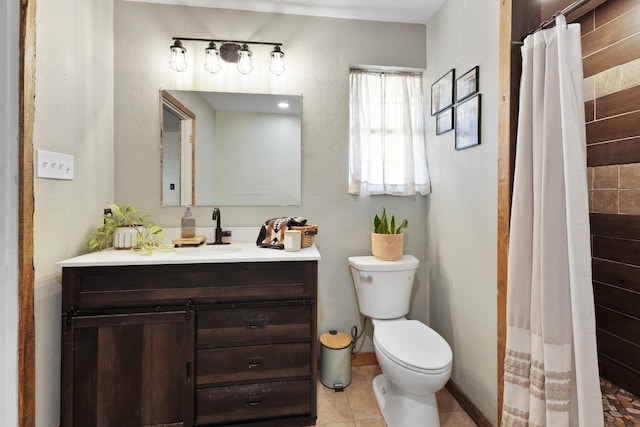 bathroom featuring toilet, tile patterned floors, a shower with curtain, and vanity