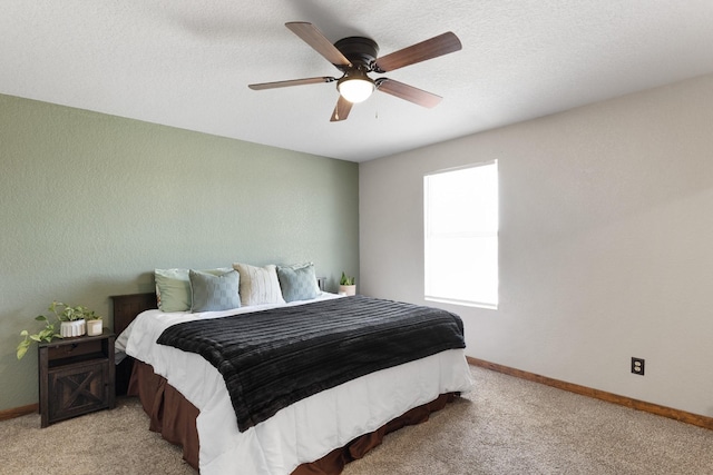 bedroom featuring baseboards, a ceiling fan, and light colored carpet