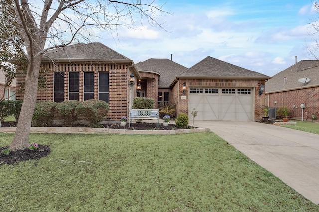 view of front facade with a garage, brick siding, driveway, and a shingled roof