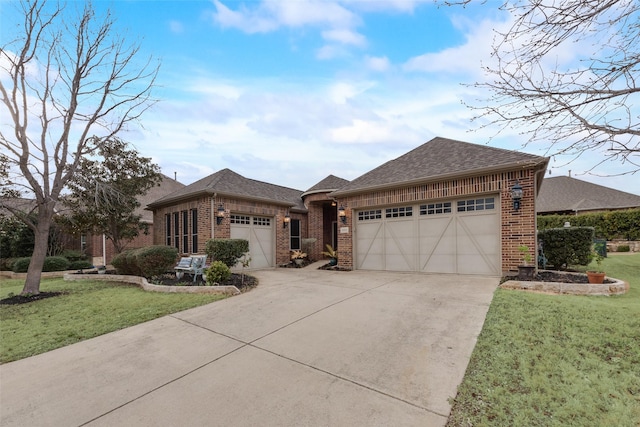 view of front of property with concrete driveway, brick siding, a front lawn, and an attached garage