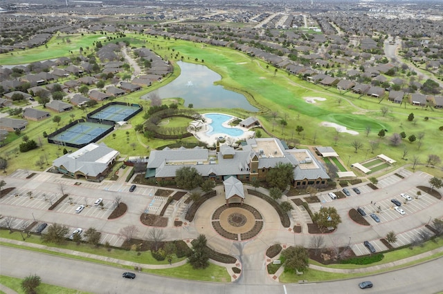 drone / aerial view featuring a water view, a residential view, and golf course view