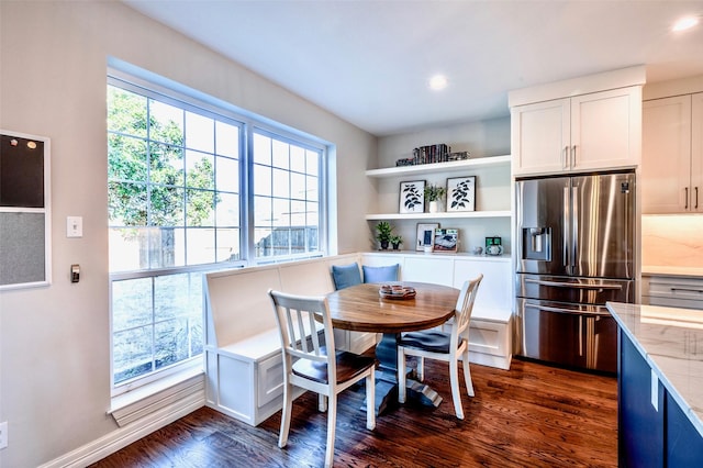 dining space featuring dark wood finished floors, recessed lighting, and baseboards