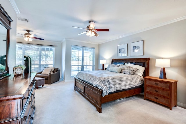 bedroom featuring crown molding, light colored carpet, and ceiling fan