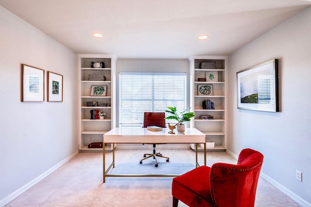 office space with recessed lighting, light colored carpet, and baseboards