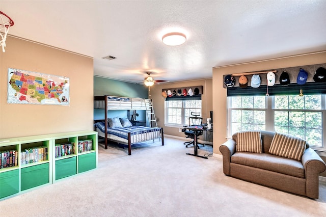 bedroom featuring visible vents, baseboards, carpet, and a textured ceiling