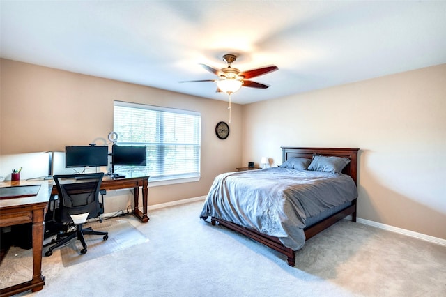 bedroom featuring baseboards and light carpet