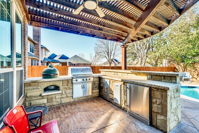 view of patio featuring area for grilling, a fenced backyard, a pergola, and grilling area