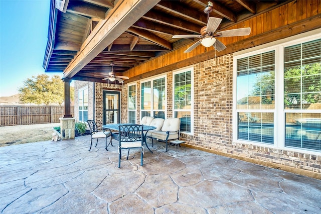 view of patio / terrace featuring a ceiling fan and fence