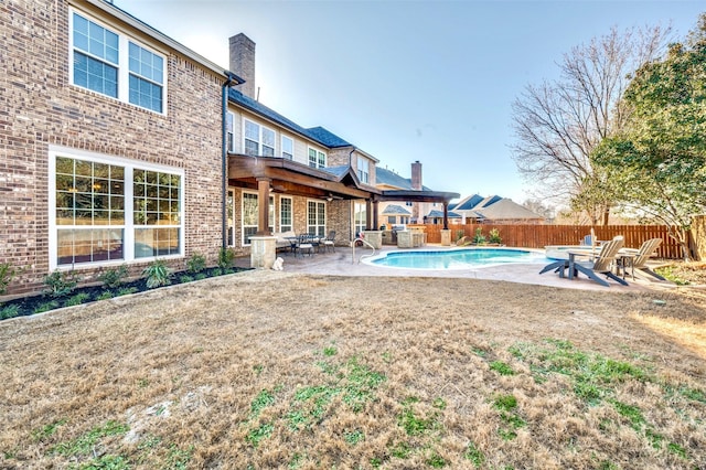 view of swimming pool featuring a fenced in pool, a fenced backyard, and a patio area