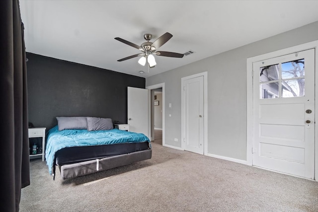 bedroom featuring a ceiling fan, carpet, visible vents, and baseboards