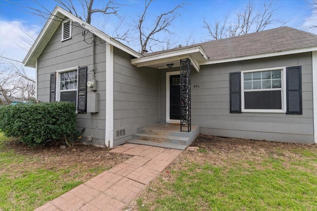 view of front of home featuring crawl space and roof with shingles