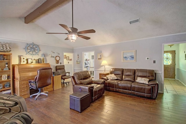 living room featuring lofted ceiling with beams, visible vents, a textured ceiling, and wood finished floors