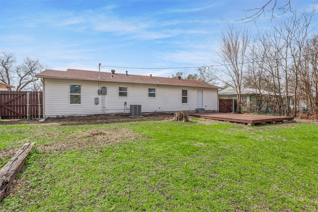 back of property featuring a yard, cooling unit, fence, and a wooden deck