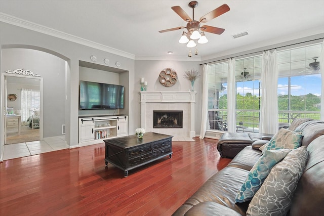 living room with visible vents, plenty of natural light, and wood finished floors