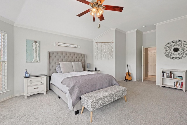 carpeted bedroom with lofted ceiling, baseboards, ornamental molding, and a ceiling fan