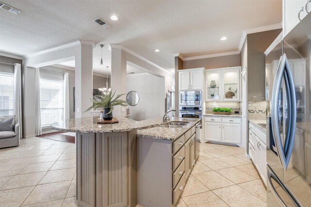 kitchen featuring light tile patterned flooring, visible vents, and appliances with stainless steel finishes