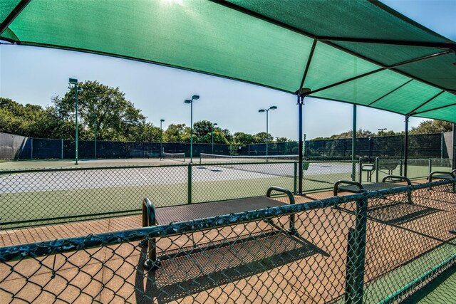 view of sport court with fence