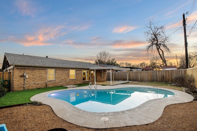 view of swimming pool with a patio area, a fenced backyard, and a fenced in pool