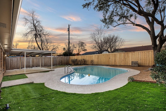 view of pool featuring a patio, a yard, a fenced backyard, and a fenced in pool