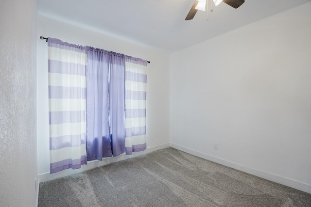 empty room featuring carpet, ceiling fan, and baseboards