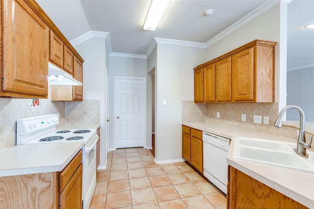 kitchen with white appliances, light tile patterned floors, light countertops, under cabinet range hood, and a sink