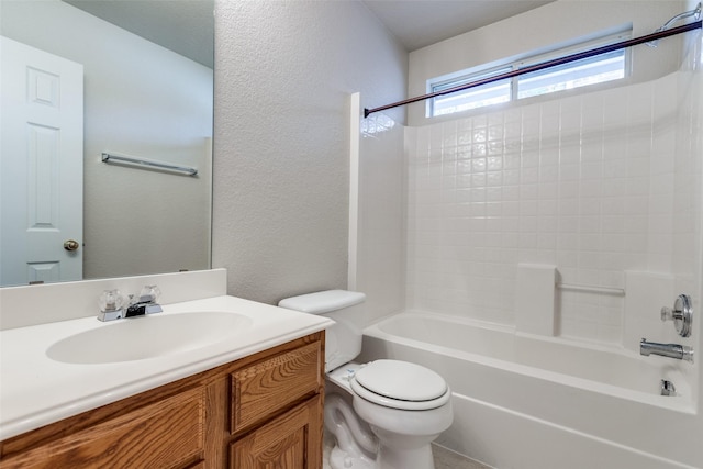 full bathroom with toilet, a textured wall, shower / bathtub combination, and vanity