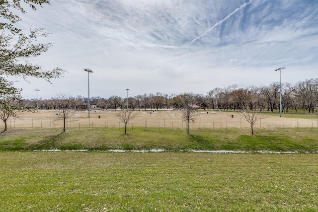 view of yard featuring a rural view and fence