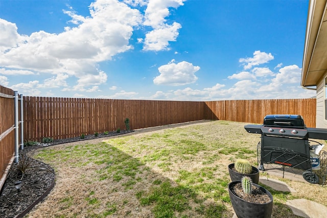 view of yard with a fenced backyard