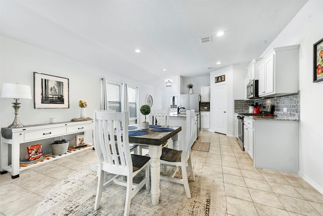 dining room featuring recessed lighting, visible vents, and light tile patterned flooring