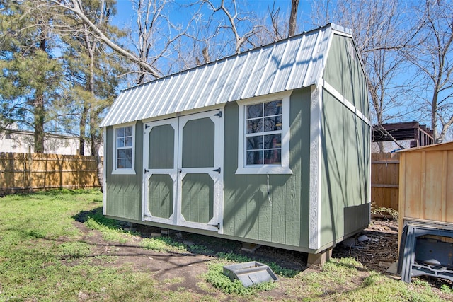 view of shed featuring a fenced backyard