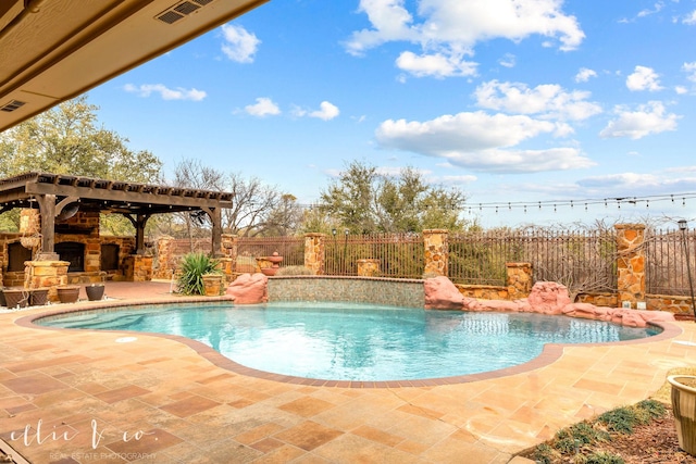 view of pool with a patio, a fenced backyard, a fireplace, a gazebo, and a fenced in pool