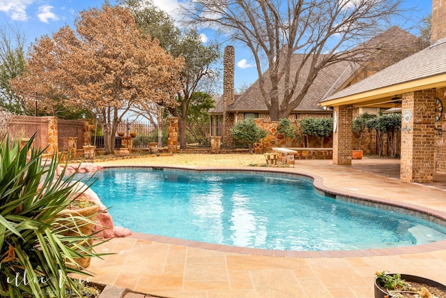 view of swimming pool with a patio area, a fenced backyard, and a fenced in pool