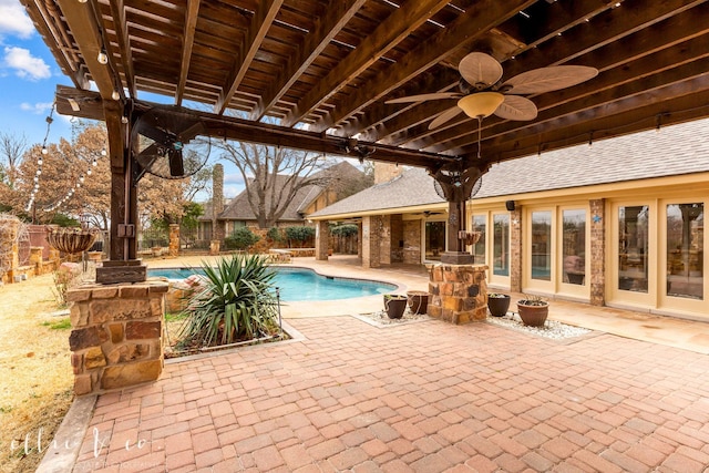 view of pool with a patio area, a fenced backyard, a ceiling fan, and a fenced in pool